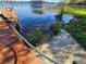 Dock on the lake with rope railing and sandy shoreline at 1003 Oakdale St, Windermere, FL 34786