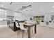 Open-concept kitchen and living area with an island, sleek countertops, and modern appliances at 1003 Oakdale St, Windermere, FL 34786