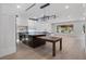 Spacious kitchen with modern lighting, granite countertops, stainless steel appliances, and a large island at 1003 Oakdale St, Windermere, FL 34786
