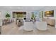 Inviting living room with comfortable seating, hardwood floors, and view of backyard at 1003 Oakdale St, Windermere, FL 34786