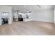 Spacious living room featuring hardwood floors and an open floor plan that flows seamlessly into the kitchen at 1003 Oakdale St, Windermere, FL 34786