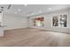 Bright and airy living room with hardwood floors and large windows offering scenic views of the outdoor area at 1003 Oakdale St, Windermere, FL 34786