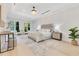 Spacious primary bedroom with tray ceilings, plush rug, and bright natural light at 1003 Oakdale St, Windermere, FL 34786