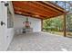 Outdoor kitchen with stainless steel grill and stone countertops, ideal for al fresco dining at 1003 Oakdale St, Windermere, FL 34786