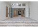 The patio features stone pavers, white pillars and offers entry through glass doors at 1003 Oakdale St, Windermere, FL 34786