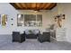 Cozy outdoor patio with a built-in grill, bar, and comfortable seating at 1003 Oakdale St, Windermere, FL 34786
