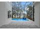Inviting pool area with fire features and screened enclosure at 1003 Oakdale St, Windermere, FL 34786