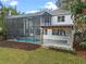Screened pool with a spacious brick patio and outdoor kitchen, perfect for entertaining at 1003 Oakdale St, Windermere, FL 34786