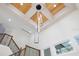 Bright staircase area featuring modern light fixtures, wood accents, and large windows at 1003 Oakdale St, Windermere, FL 34786