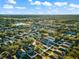 Expansive aerial view of a residential neighborhood with tree-lined streets and manicured lawns at 15321 Beamleigh Rd, Winter Garden, FL 34787