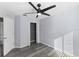 Light-filled bedroom with a modern ceiling fan, wood-look floors, and closet at 15321 Beamleigh Rd, Winter Garden, FL 34787