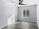 Bright bedroom featuring a modern ceiling fan and wood-look floors at 15321 Beamleigh Rd, Winter Garden, FL 34787