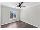 Well-lit bedroom features a modern ceiling fan and wood-look floors at 15321 Beamleigh Rd, Winter Garden, FL 34787