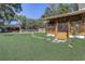 Backyard with stone paver pathway and covered porch at 3260 Se 32Nd Ct, Ocala, FL 34471