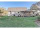 View of the backyard with a covered porch at 3260 Se 32Nd Ct, Ocala, FL 34471