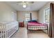 Bedroom with neutral walls, ceiling fan, and closet space at 3260 Se 32Nd Ct, Ocala, FL 34471