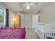 Bedroom with neutral walls, ceiling fan, and closet space at 3260 Se 32Nd Ct, Ocala, FL 34471