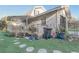 Exterior of the home, featuring a back porch and landscaped yard at 3260 Se 32Nd Ct, Ocala, FL 34471