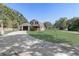 Charming home with attached garage, covered porch, and lush green lawn at 3260 Se 32Nd Ct, Ocala, FL 34471