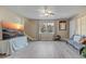 Open living room featuring wood-look floors and natural light at 3260 Se 32Nd Ct, Ocala, FL 34471
