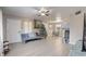 Spacious living room with neutral walls and ceiling fan at 3260 Se 32Nd Ct, Ocala, FL 34471