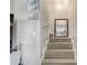 Stairway with wood stairs and white risers leads to the upper level of the home at 3260 Se 32Nd Ct, Ocala, FL 34471