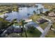 Bird's eye view of a waterfront property with a private beach at 3870 W Stillwood Ln, Lake Mary, FL 32746