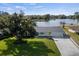 Lakefront property showcasing home and dock at 3870 W Stillwood Ln, Lake Mary, FL 32746