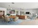 Open concept dining room with mid-century modern furniture at 3870 W Stillwood Ln, Lake Mary, FL 32746