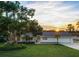 House exterior at sunset with lush landscaping at 3870 W Stillwood Ln, Lake Mary, FL 32746