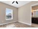 This bedroom features a closet and a window at 4363 Summer Breeze Way, Kissimmee, FL 34744
