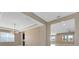 Open-concept dining room featuring tiled floors, modern lighting, and easy access to living area at 4363 Summer Breeze Way, Kissimmee, FL 34744