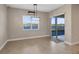 Bright dining room featuring a window with views of the water and access to a private patio at 4363 Summer Breeze Way, Kissimmee, FL 34744