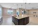 Kitchen island boasting granite countertops with views of the water at 4363 Summer Breeze Way, Kissimmee, FL 34744