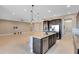 Open concept kitchen with granite island, stainless steel appliances, and breakfast bar at 4363 Summer Breeze Way, Kissimmee, FL 34744