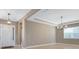Inviting entryway with tiled floors and decorative lighting fixture at 4363 Summer Breeze Way, Kissimmee, FL 34744