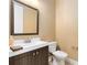 This powder room features modern fixtures at 4363 Summer Breeze Way, Kissimmee, FL 34744