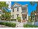 Charming two-story home featuring a white picket fence, front porch, and manicured landscaping at 4685 Anson Ln, Orlando, FL 32814