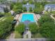 Aerial view of a community pool with lounge chairs and lush landscaping creating a resort-like atmosphere at 4685 Anson Ln, Orlando, FL 32814