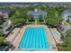 Community pool with lap lanes, pool, lounge chairs and umbrellas nestled in a residential neighborhood at 4685 Anson Ln, Orlando, FL 32814