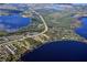 Aerial view of a lakeside community with lush greenery and waterways at 9105 Sheen Sound St, Orlando, FL 32836