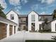 Stylish two-story home with white brick and a dark gray metal roof at 9105 Sheen Sound St, Orlando, FL 32836