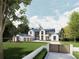 Modern farmhouse exterior, featuring a three-car garage and gated entry at 9105 Sheen Sound St, Orlando, FL 32836