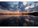 Scenic lake view at sunset, reflecting colorful clouds in the water at 9105 Sheen Sound St, Orlando, FL 32836