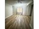Bright bedroom features wood-look flooring and natural light from the window at 1234 Sago Palm Blvd # 1234, Kissimmee, FL 34741