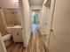 Hallway with access to bathroom, bedroom, and tile floors at 1234 Sago Palm Blvd # 1234, Kissimmee, FL 34741