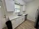 Updated kitchen featuring quartz countertops, stainless steel appliances, and tile floors at 1234 Sago Palm Blvd # 1234, Kissimmee, FL 34741