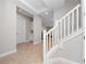 Entryway featuring a staircase with white railing, tile floors, and access to storage space at 13333 Oakenshaw Ln, Orlando, FL 32832