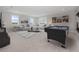 Spacious game room with a pool table, comfortable seating area, and bright, natural light from large windows at 13333 Oakenshaw Ln, Orlando, FL 32832