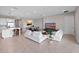 Bright, open layout with modern sofas, a dining area, and a stylish kitchen with bar seating at 13333 Oakenshaw Ln, Orlando, FL 32832